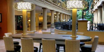 business table ideal for coworking or remote work at Embassy Suites by Hilton Los Angeles International Airport South.