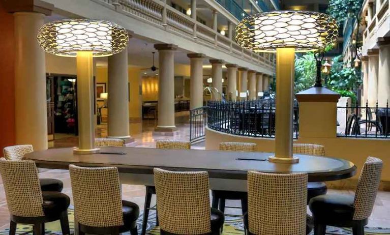 business table ideal for coworking or remote work at Embassy Suites by Hilton Los Angeles International Airport South.