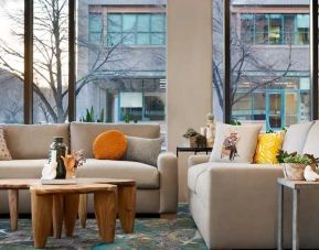 comfortable lobby lounge area with natural light ideal for coworking at Embassy Suites by Hilton Boulder.
