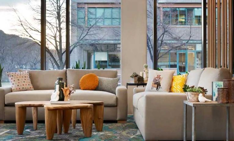 comfortable lobby lounge area with natural light ideal for coworking at Embassy Suites by Hilton Boulder.