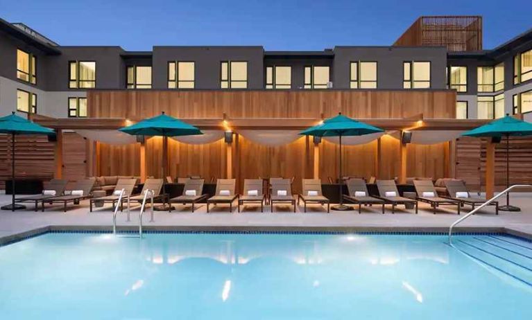 beautiful outdoor pool with sunbeds and seating area at Hilton Garden Inn Boulder.