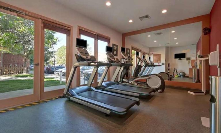 well-equipped fitness center with lots of natural light at Homewood Suites by Hilton - Boulder.