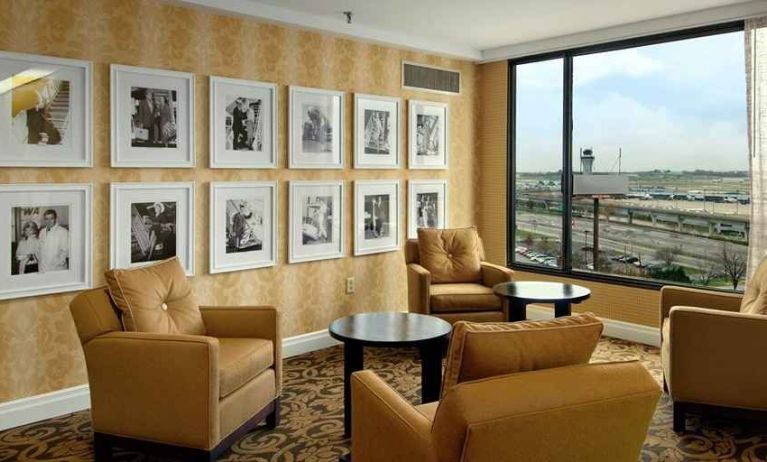 comfortable lobby lounge area with natural light ideal for coworking at Hilton St. Louis Airport.