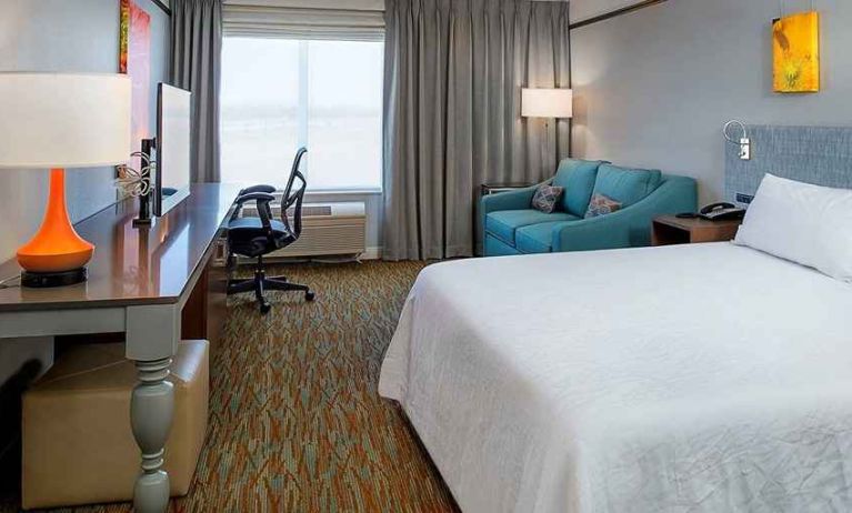 spacious delux king room with lounge area and work desk ideal for working remotely at Hilton Garden Inn St. Louis/O'Fallon MO.