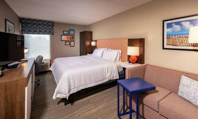 spacious delux king room with lounge area and work desk ideal for working remotely at Hampton Inn Fall River/Westport.