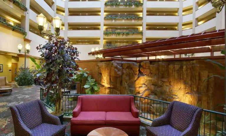 Comfortable workspace in a hotel lobby at the Embassy Suites by Hilton Charleston Airport Convention Center.