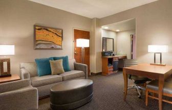 Spacious living room in a hotel suite at the Embassy Suites by Hilton Nashville - South-Cool Springs.