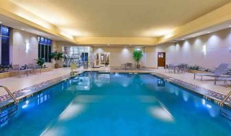 Indoor pool area with lounges at the Embassy Suites by Hilton Nashville - South-Cool Springs.