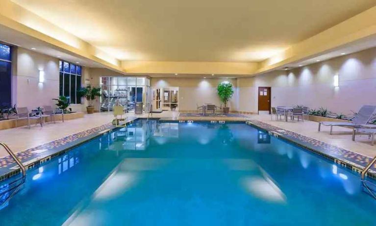 Indoor pool area with lounges at the Embassy Suites by Hilton Nashville - South-Cool Springs.