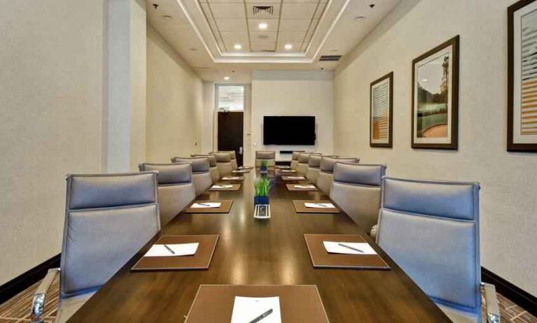 Elegant meeting room with comfortable chairs at the Embassy Suites by Hilton Greenville Golf Resort Conference Center