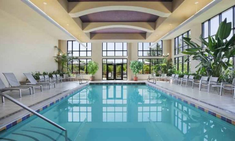 Bright hotel area with indoor pool at the Embassy Suites by Hilton Hot Springs Hotel & Spa.