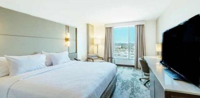 spacious king room with lots of natural light at Hilton Garden Inn Denver Union Station.