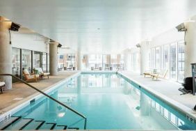 beautiful indoor pool with seating area at Hilton Garden Inn Denver Union Station.