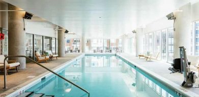 beautiful indoor pool with seating area at Hilton Garden Inn Denver Union Station.