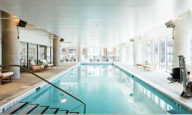 beautiful indoor pool with seating area at Hilton Garden Inn Denver Union Station.