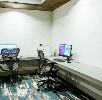 dedicated business center with PC, printer, and work desk ideal for working remotely at Hilton Garden Inn Denver Union Station.