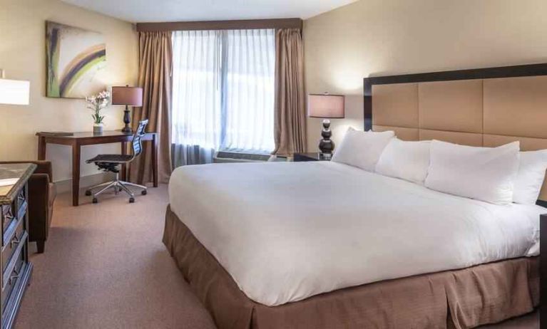 Comfortable king bedroom with desk at the Hilton Galveston Island Resort.