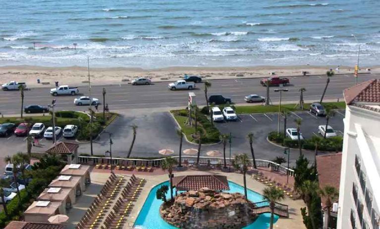 Outdoor pool area in front of the beach at the Hilton Galveston Island Resort.