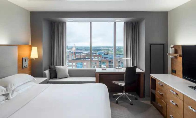 King bedroom with desk and view at the Hilton Columbus Downtown.