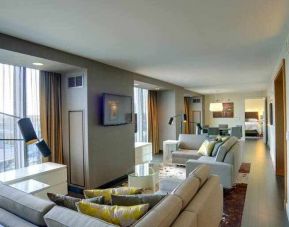 Spacious presidential living room with sofas and table at the Hilton Columbus Downtown.