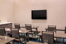 Meeting room with tables and chairs at the Hilton Garden Inn Financial Center Manhattan Downtown, NY.