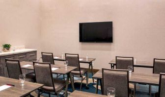 Meeting room with tables and chairs at the Hilton Garden Inn Financial Center Manhattan Downtown, NY.