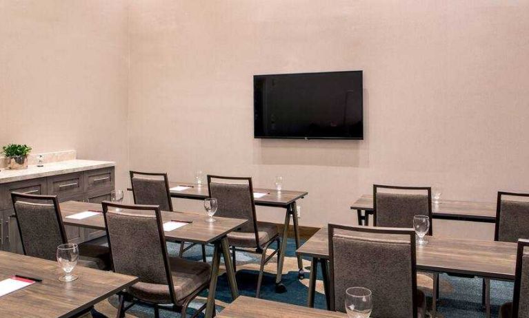 Meeting room with tables and chairs at the Hilton Garden Inn Financial Center Manhattan Downtown, NY.