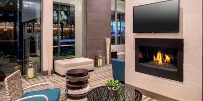 Comfortable lobby workspace by the fireplace at the Hilton Garden Inn Financial Center Manhattan Downtown, NY.