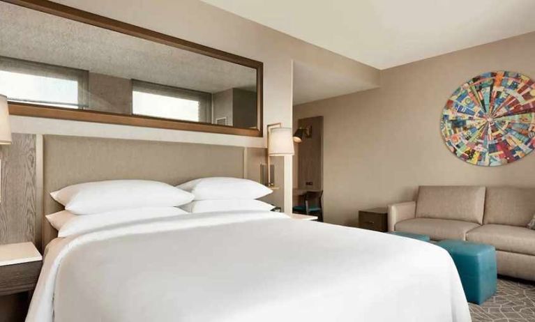 spacious king bedroom with natural light at Embassy Suites by Hilton Minneapolis Downtown.