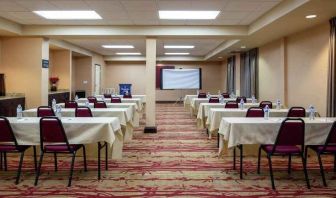 Large meeting room with tables and chairs at the Hampton Inn Albuquerque, University-Midtown (UNM).