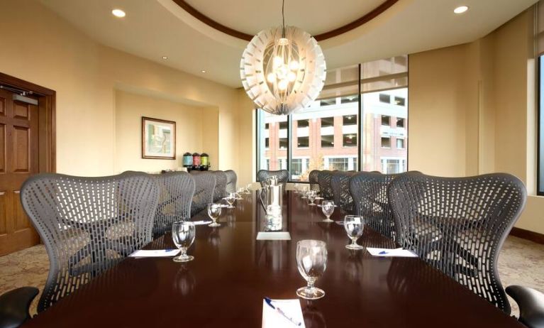 Bright meeting room with windows at the Hilton Garden Inn Baltimore Inner Harbor.