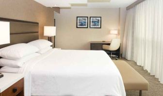 spacious delux king room with work desk and natural light ideal for working remotely at Embassy Suites by Hilton Seattle North Lynnwood.