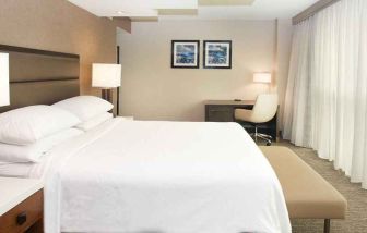 spacious delux king room with work desk and natural light ideal for working remotely at Embassy Suites by Hilton Seattle North Lynnwood.