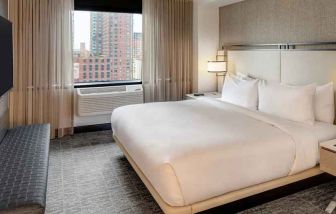 relaxing delux king room with TV at DoubleTree by Hilton Hotel & Suites Jersey City.