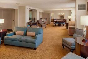 Spacious living room in a presidential suite perfect as workspace at the DoubleTree by Hilton Tulsa-Downtown.