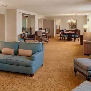 Spacious living room in a presidential suite perfect as workspace at the DoubleTree by Hilton Tulsa-Downtown.