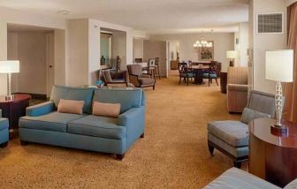 Spacious living room in a presidential suite perfect as workspace at the DoubleTree by Hilton Tulsa-Downtown.