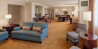 Spacious living room in a presidential suite perfect as workspace at the DoubleTree by Hilton Tulsa-Downtown.