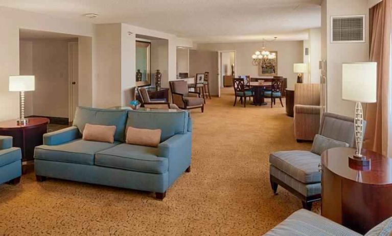 Spacious living room in a presidential suite perfect as workspace at the DoubleTree by Hilton Tulsa-Downtown.