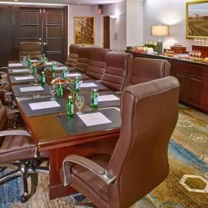 Elegant meeting room with comfortable chairs at the DoubleTree by Hilton Tulsa-Downtown.