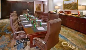 Elegant meeting room with comfortable chairs at the DoubleTree by Hilton Tulsa-Downtown.