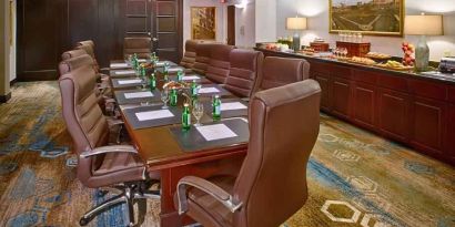 Elegant meeting room with comfortable chairs at the DoubleTree by Hilton Tulsa-Downtown.