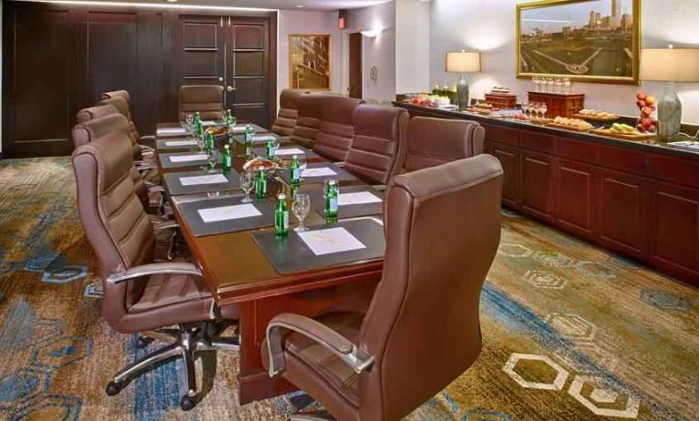 Elegant meeting room with comfortable chairs at the DoubleTree by Hilton Tulsa-Downtown.