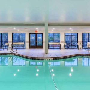 Indoor pool with lounges at the Hampton Inn Boston-Peabody.