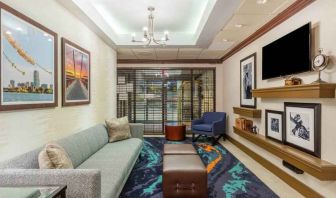 Comfortable and stylish lobby workspace at the Hampton Inn Boston-Peabody.