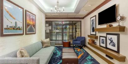 Comfortable and stylish lobby workspace at the Hampton Inn Boston-Peabody.