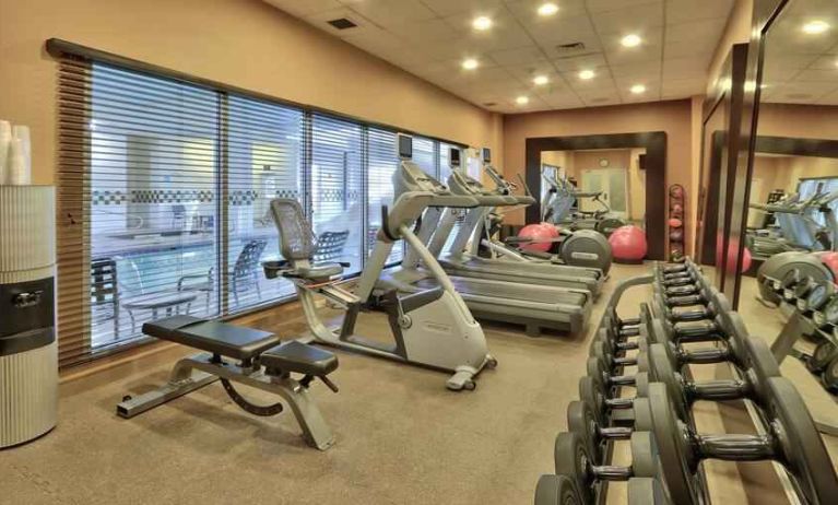 Weights and machines at the fitness center of the Hilton Garden Inn Albuquerque Uptown.