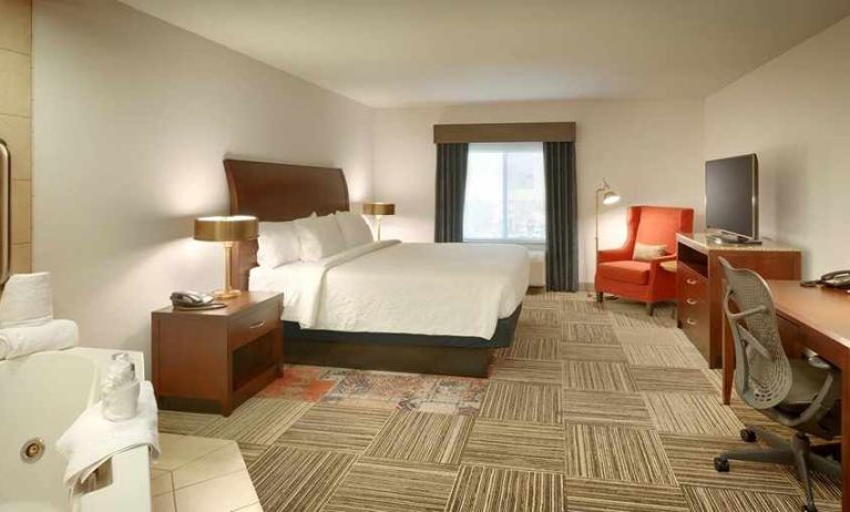 spacious delux king room with lounge area and work desk ideal for working remotely at Hilton Garden Inn Salt Lake City/Sandy.