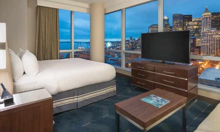 beautiful king suite with TV and city views at Embassy Suites by Hilton Seattle Downtown Pioneer Square.