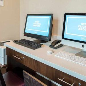 dedicated business center with printers, internet, and work desks ideal for working remotely at Embassy Suites by Hilton Seattle Downtown Pioneer Square.